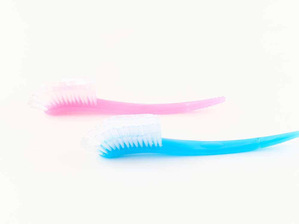 Sturdy toothbrush style cap brush